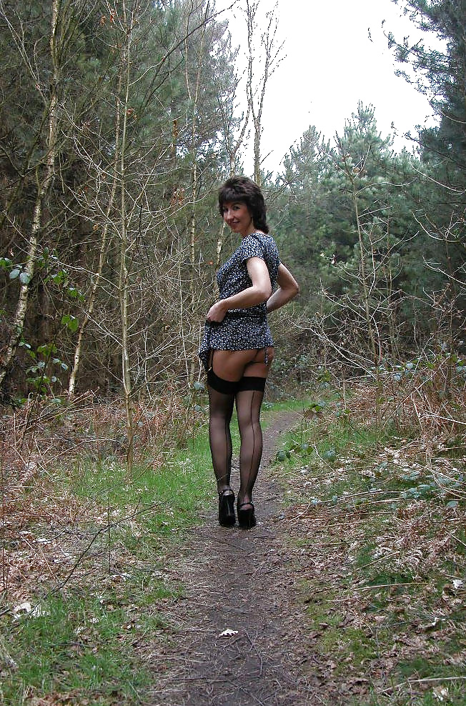 Porn image Amateur mature lady takes a walk in the woods.