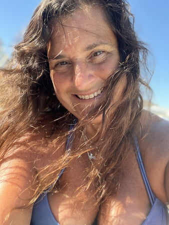 sunning in sexy purple bikini         