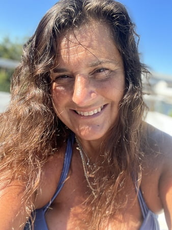 sunning in sexy purple bikini         