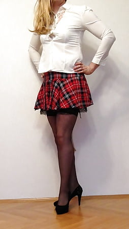 Slave slut in school uniform with tail butt plug