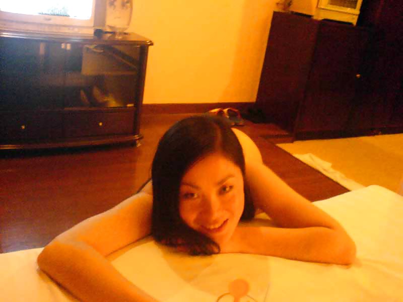 Porn image asian showing her tits
