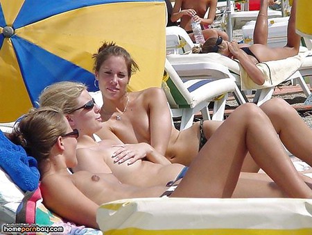 Stunning topless babes on the beach