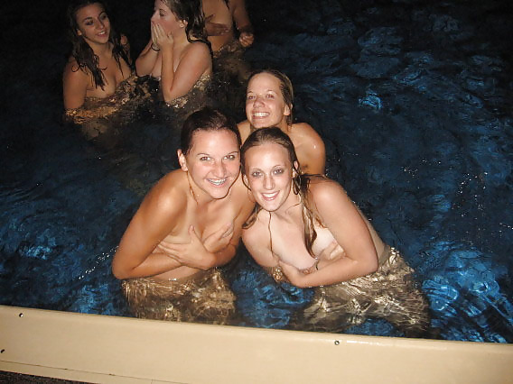 Porn image Naked girls playing in a pool by night