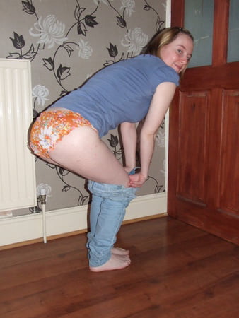 cute blonde posing in jeans and shirt         