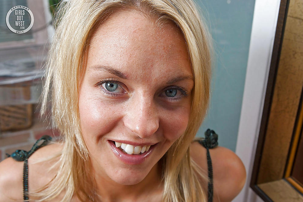 Porn image Slender amateur babe spreading her shaved holes