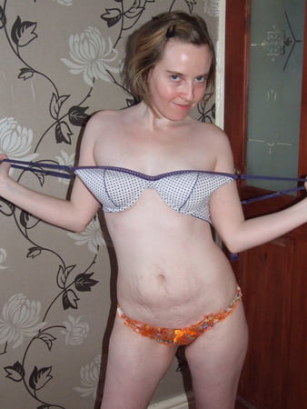 cute blonde posing in jeans and shirt         