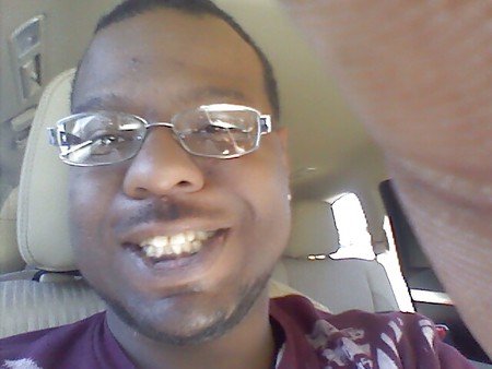 good looking black man smiling checkout my profile!